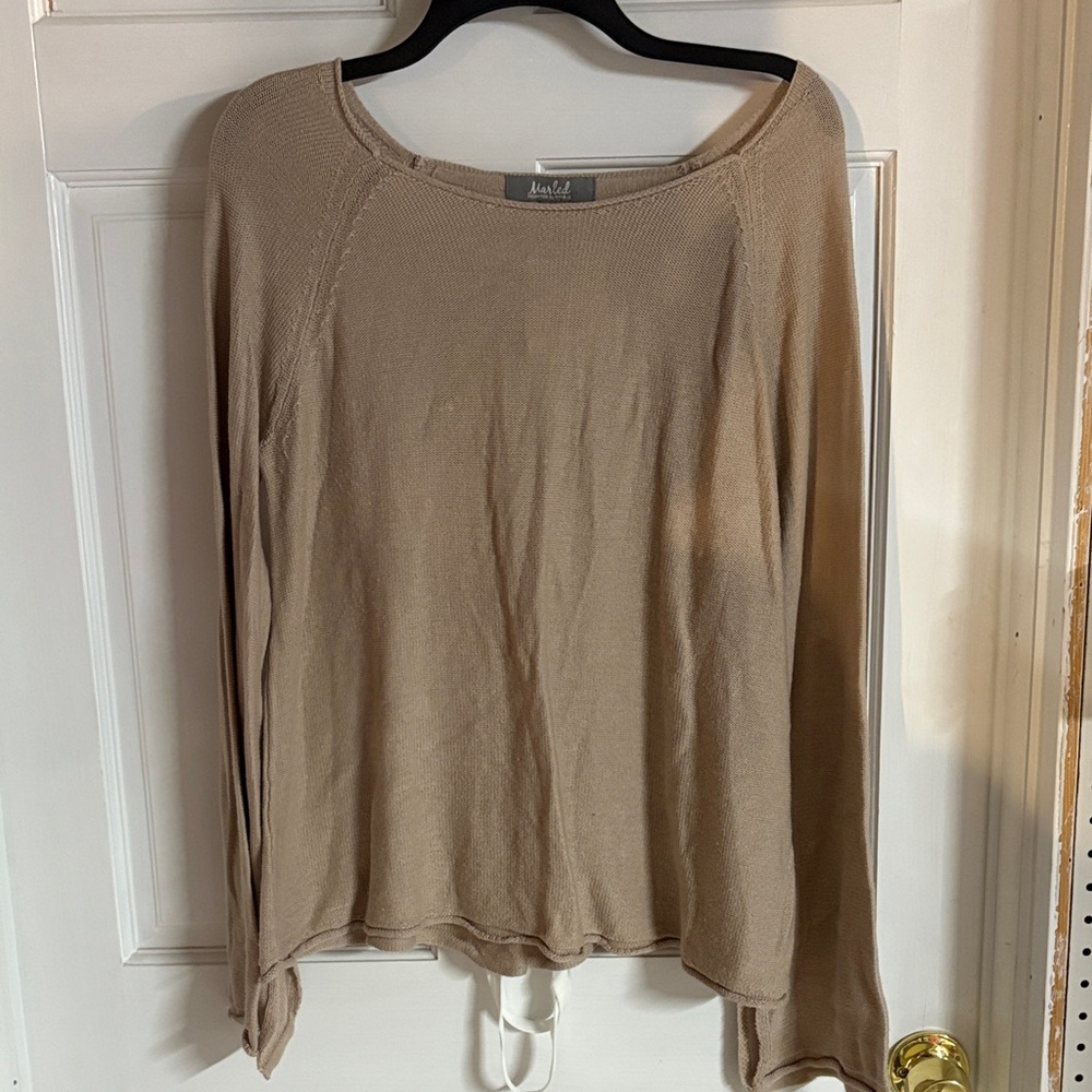 Tan sweater, ribbons up back